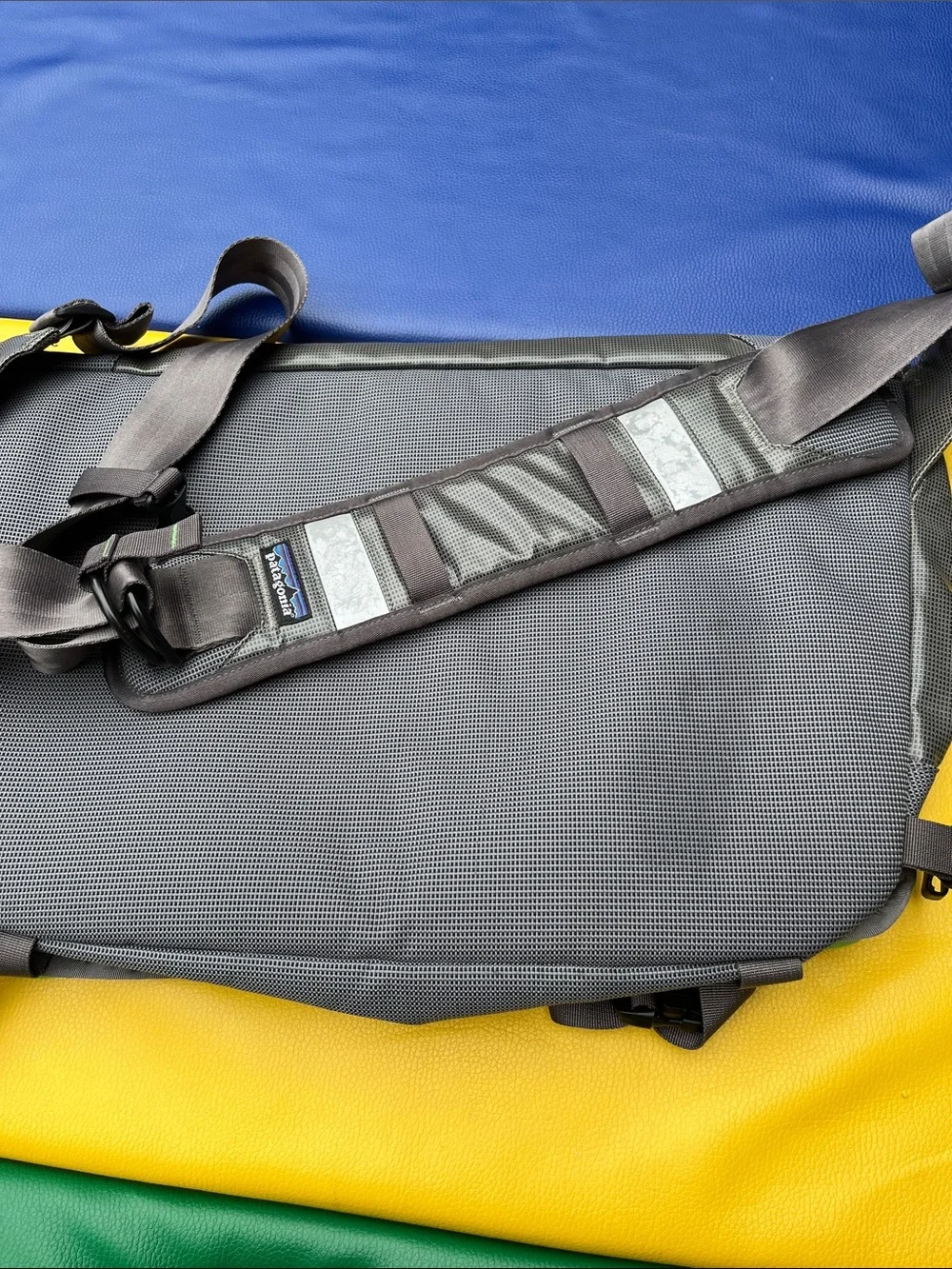 Patagonia’s Gray Messenger Bag with Green Accents older black hole